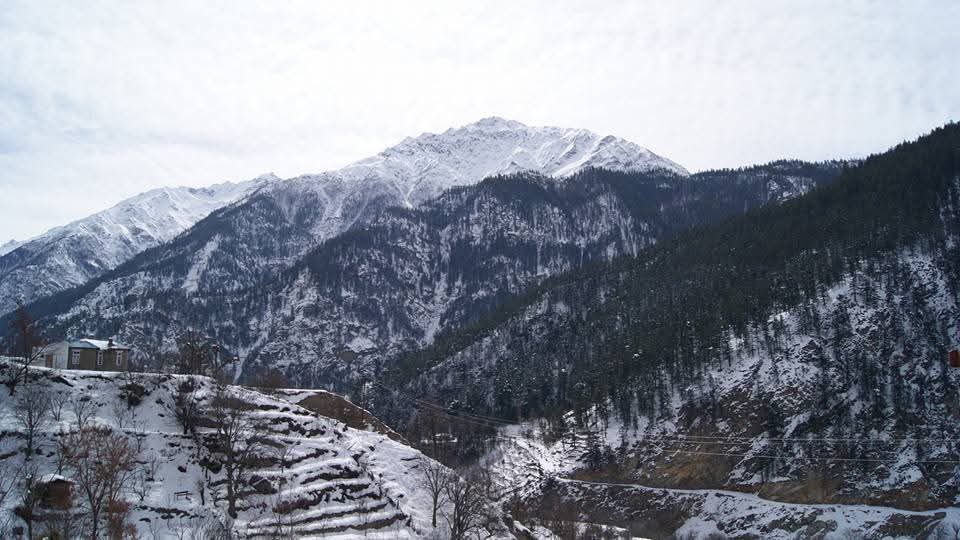 Sangla Valley Snowy mountains and serene landscape