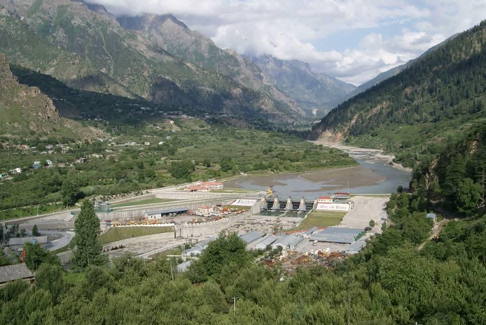Sangla Valley Dam surrounded by mountains and greenery